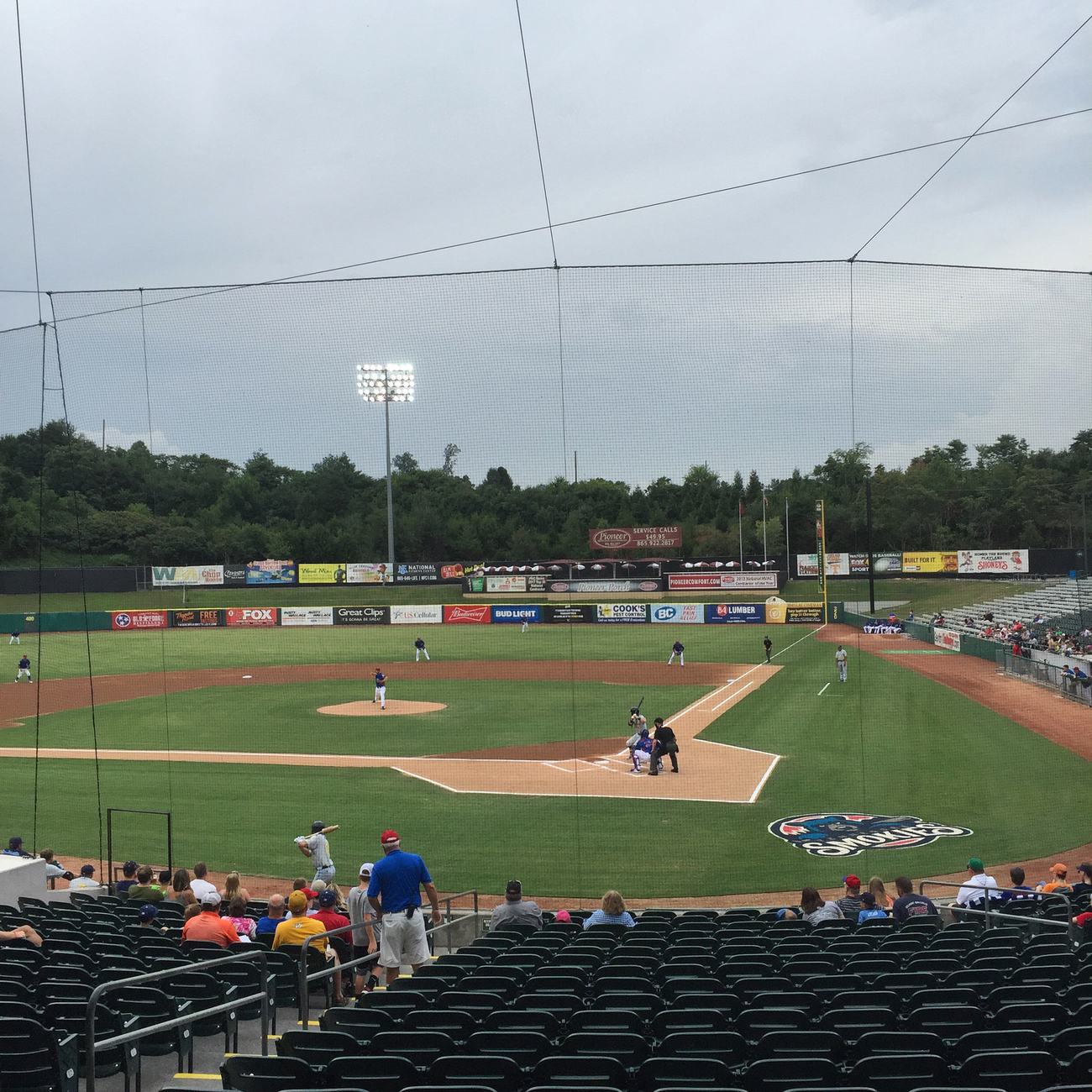 Smokies Stadium in Kodak, Tennessee, storm clouds over the outfield